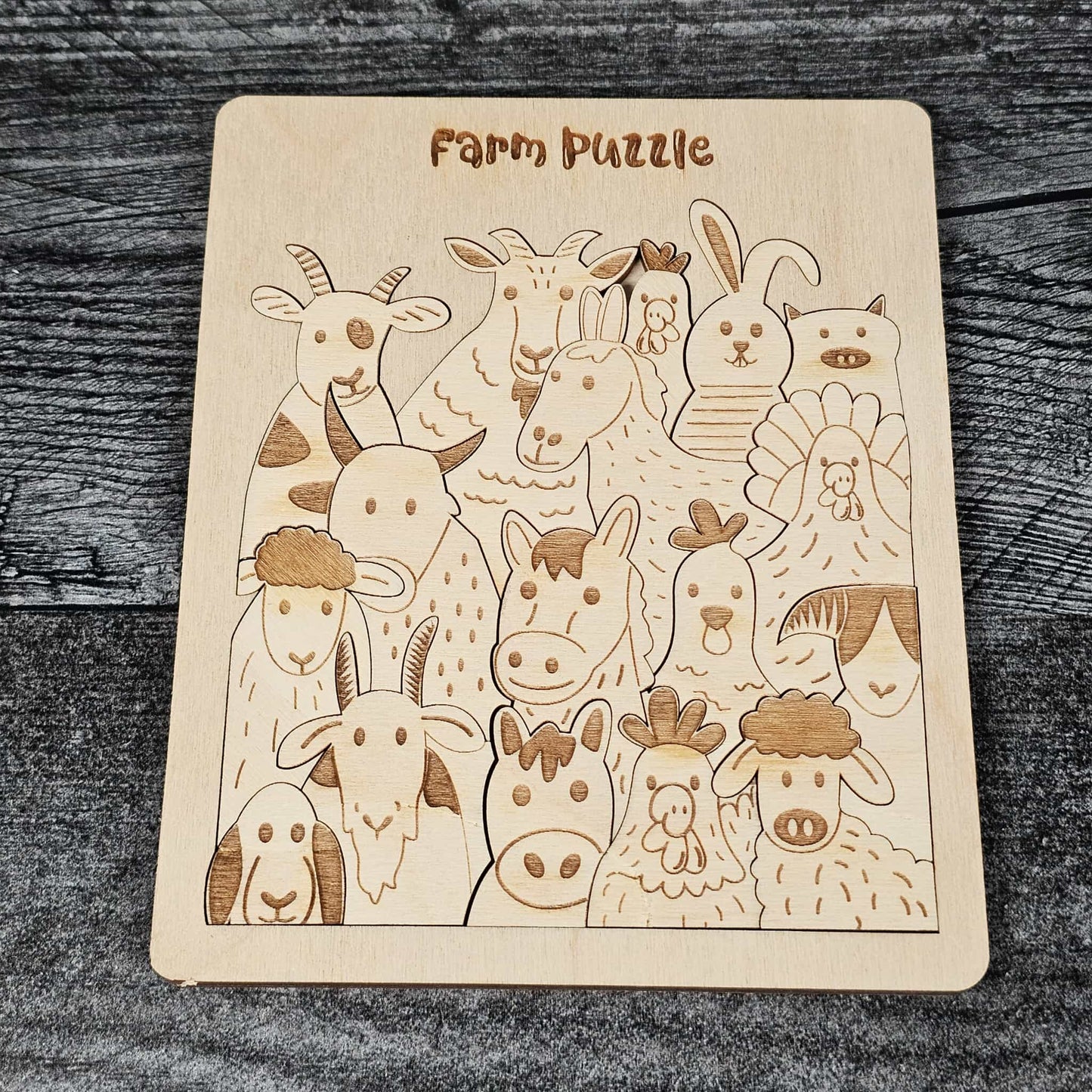 Wooden farm animal puzzle on a wooden surface