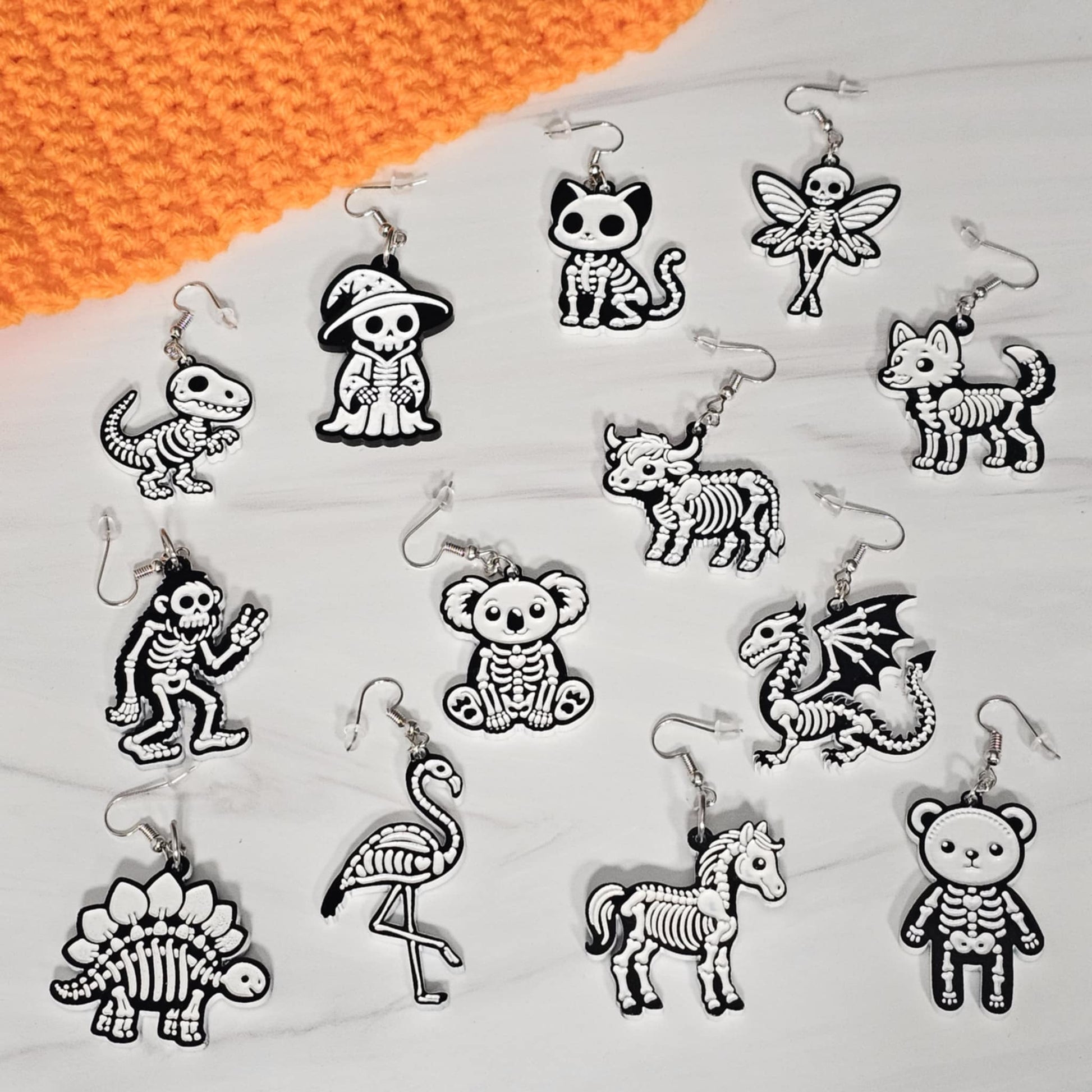 Collection of skeleton-themed keychains on a white background