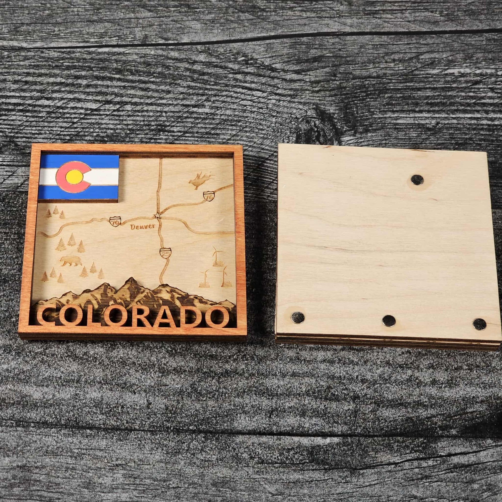 Wooden puzzle piece with Colorado map and flag on a wooden surface