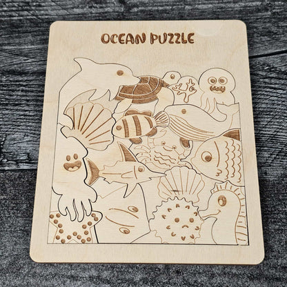 Wooden ocean puzzle with various sea creatures on a wooden surface