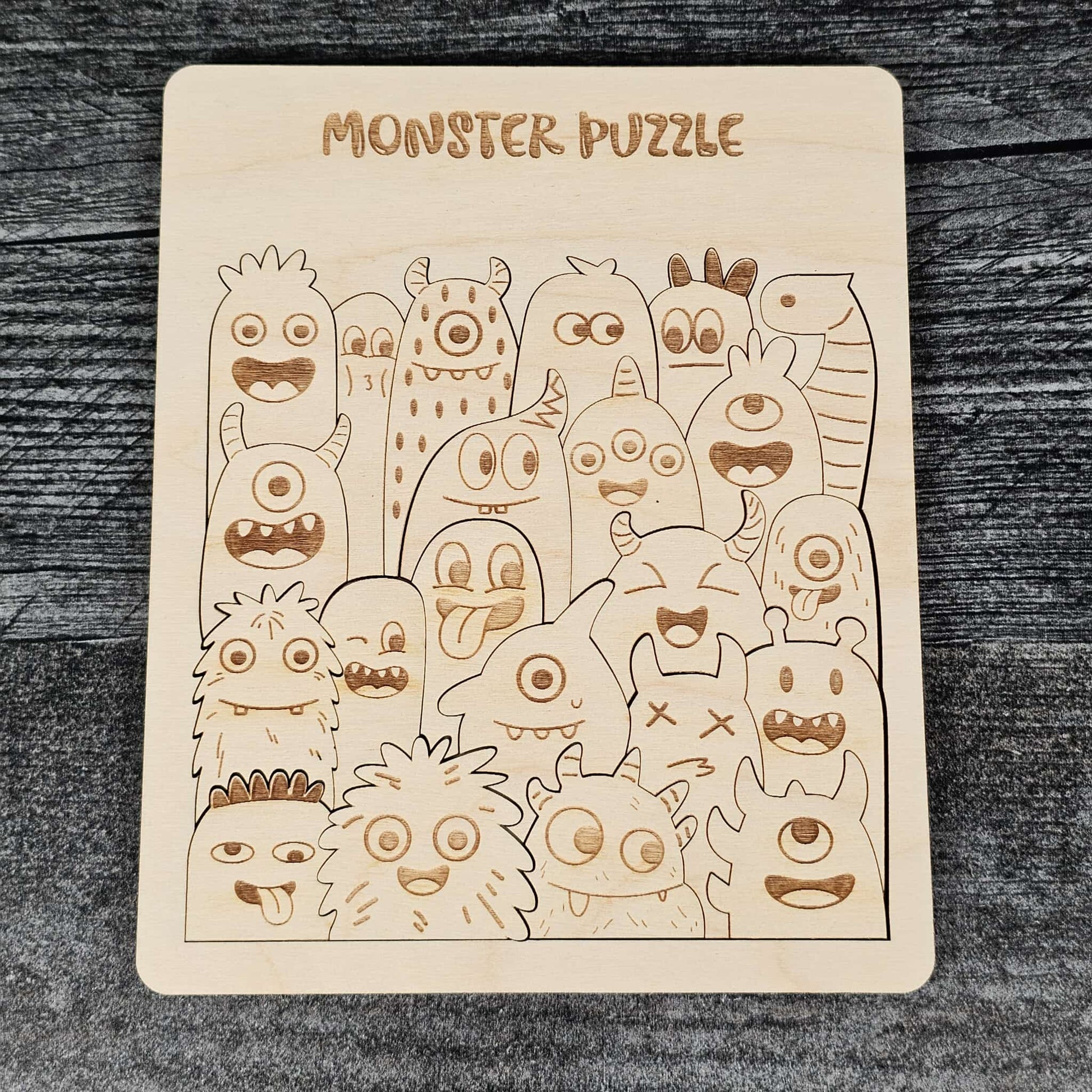 Wooden monster puzzle on a dark wooden surface