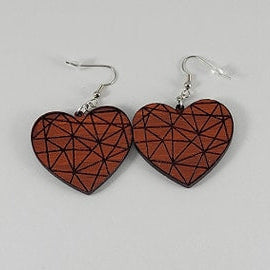 Heart-shaped earrings with geometric design on a gray background