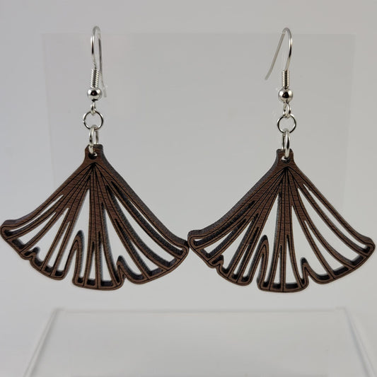 A pair of brown ginkgo leaf-shaped earrings with silver hooks and a silicone backing, displayed against a white background.
