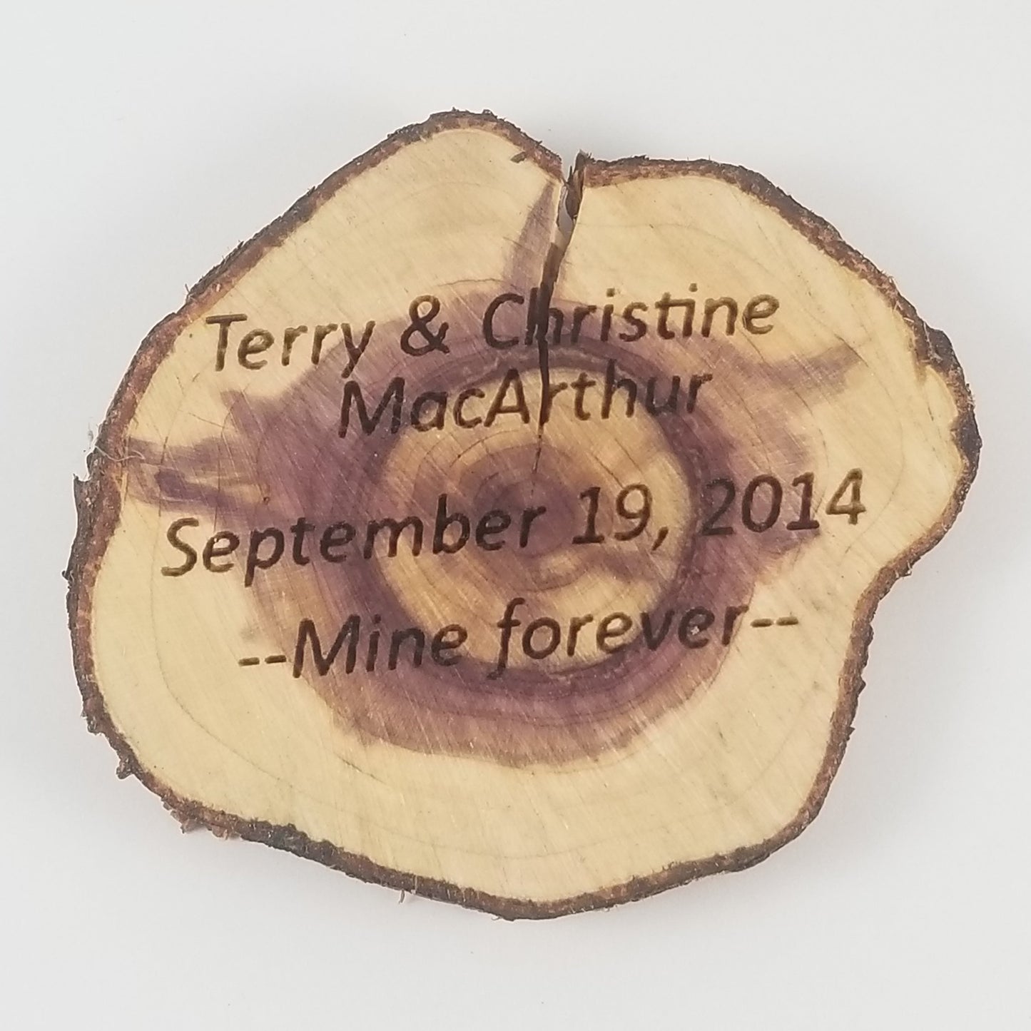 Wooden plaque with engraved text on a white background