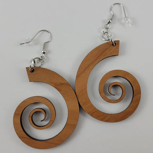 A pair of brown wooden nautilus spiral earrings with silver hooks.