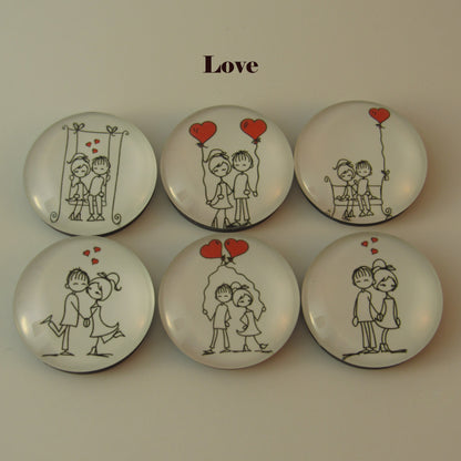 Set of six decorative buttons with romantic illustrations and 'Love' text on a beige background